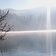 Montiggler See halb zugefroren Schnee Ente