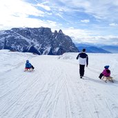 seiser alm winter puflatsch schlern rodel menschen