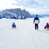 seiser alm winter puflatsch schlern rodel menschen