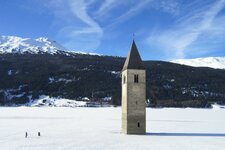 reschensee vinschgau winter zugefroren gefroren